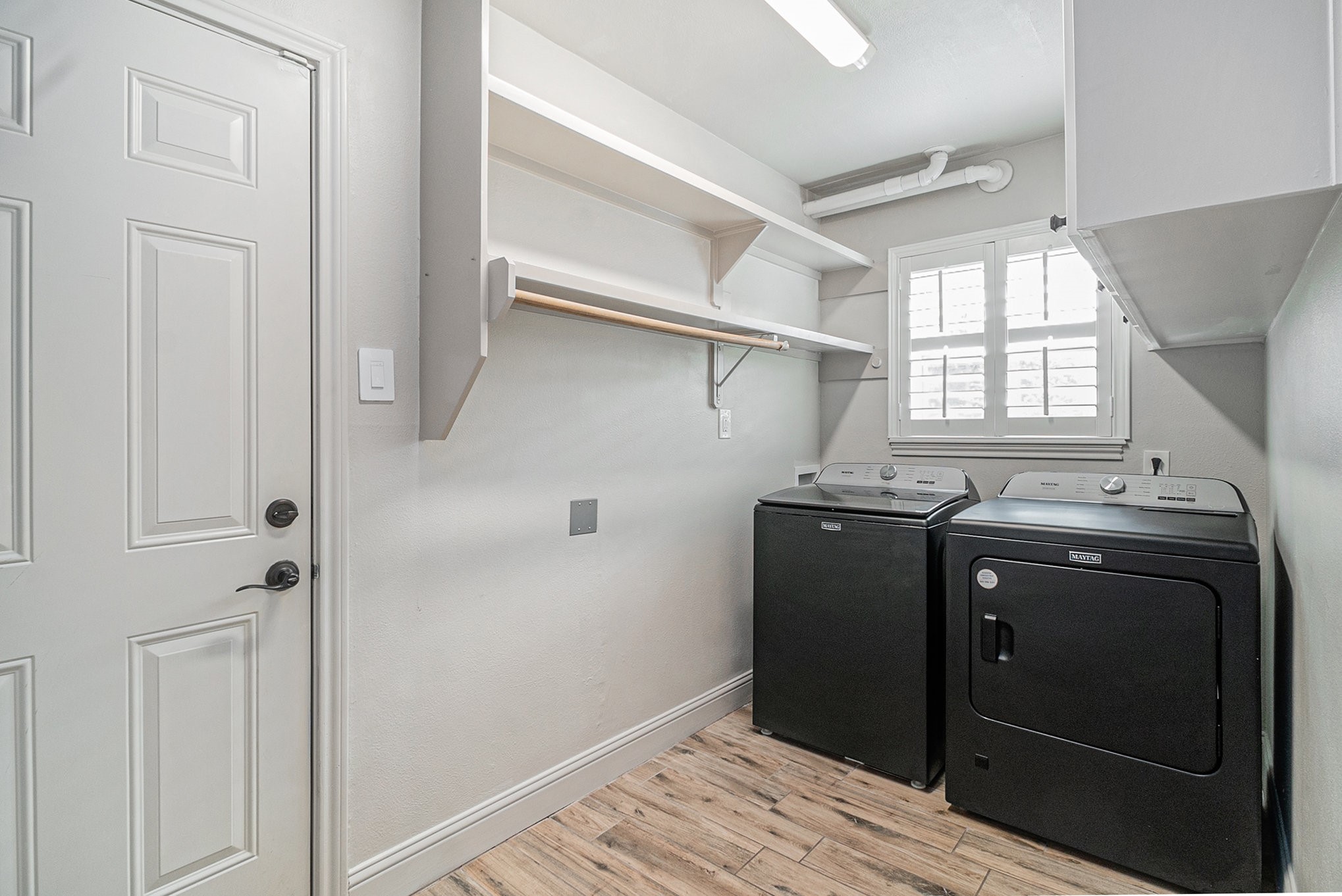 10602 Del Monte Drive Houston, TX 77042 - Photo 17 of 37 a kitchen with a refrigerator and window