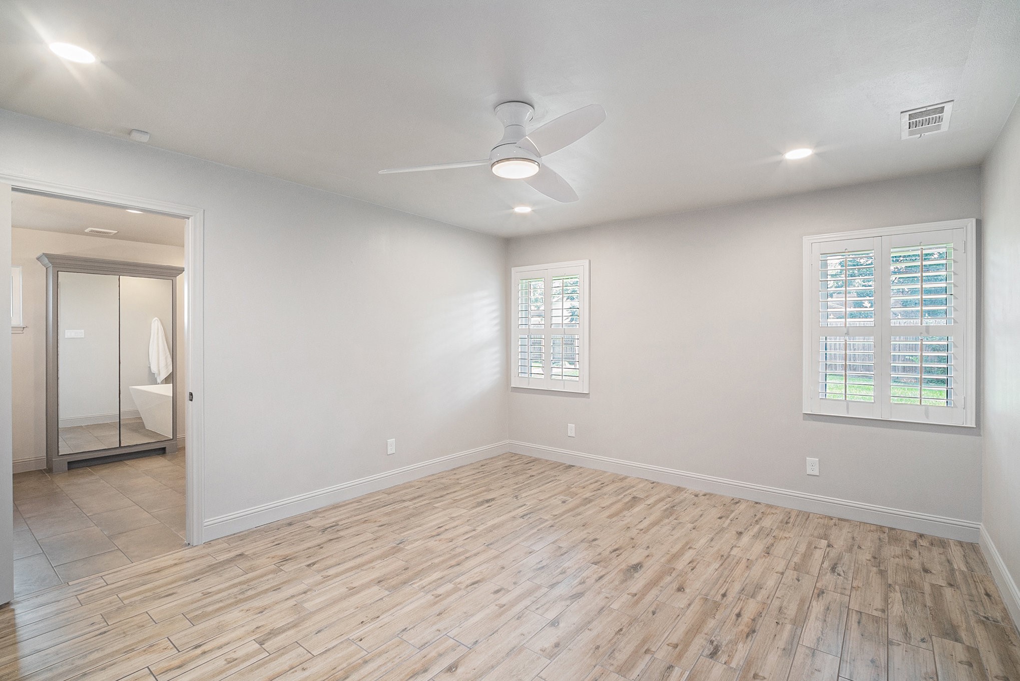 10602 Del Monte Drive Houston, TX 77042 - Photo 18 of 37 wooden floor in an empty room with a window