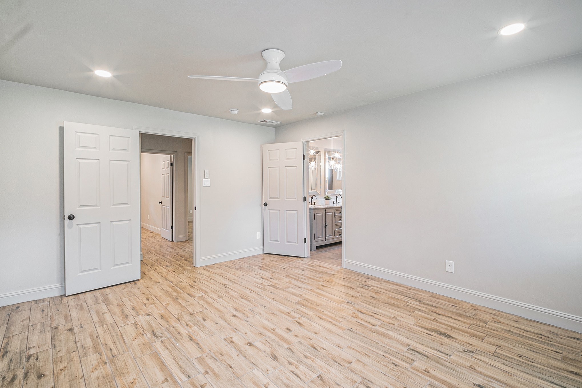 10602 Del Monte Drive Houston, TX 77042 - Photo 19 of 37 a view of empty room with wooden floor