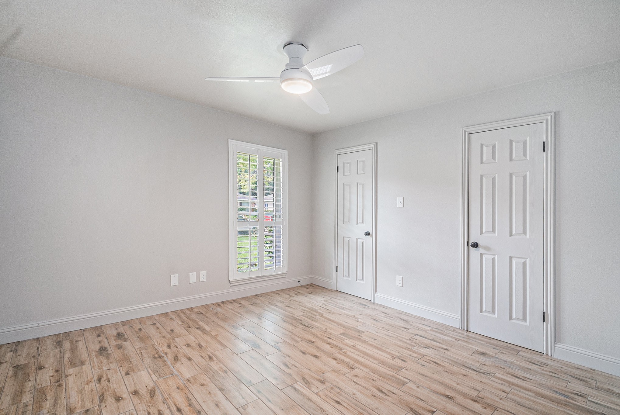 10602 Del Monte Drive Houston, TX 77042 - Photo 24 of 37 wooden floor in an empty room with a window