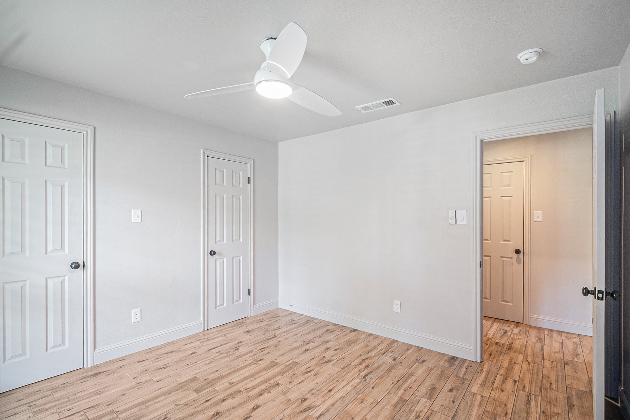 10602 Del Monte Drive Houston, TX 77042 - Photo 26 of 37 a view of empty room with wooden floor
