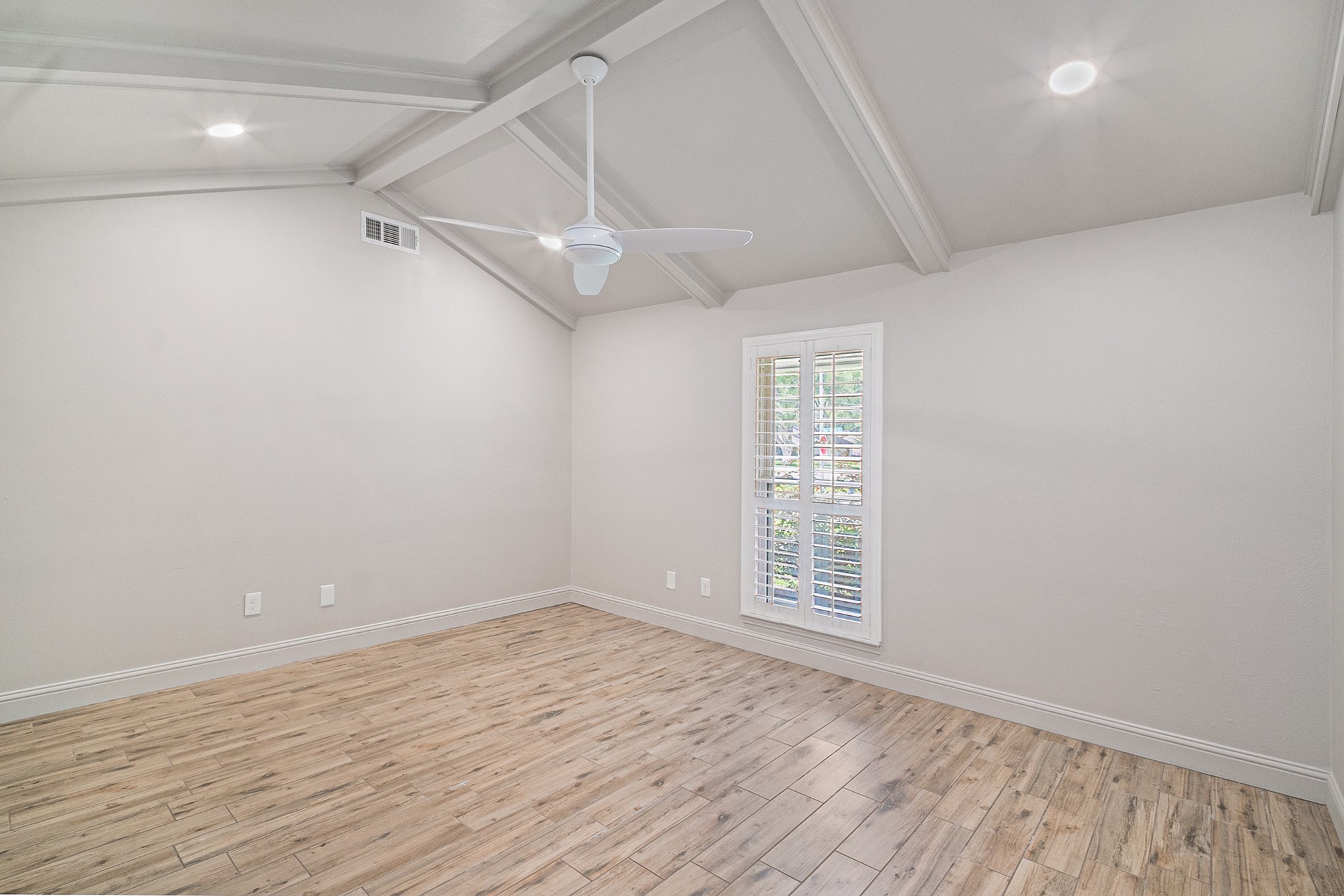 10602 Del Monte Drive Houston, TX 77042 - Photo 27 of 37 wooden floor in an empty room with a window