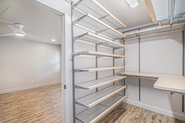 a view of an empty walk in closet