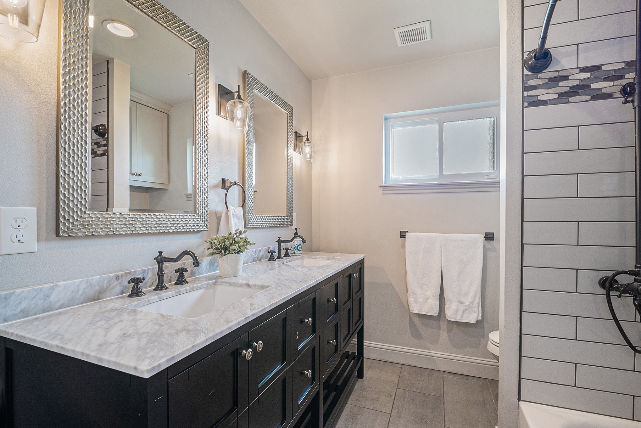 10602 Del Monte Drive Houston, TX 77042 - Photo 31 of 37 a bathroom with a sink vanity and a mirror