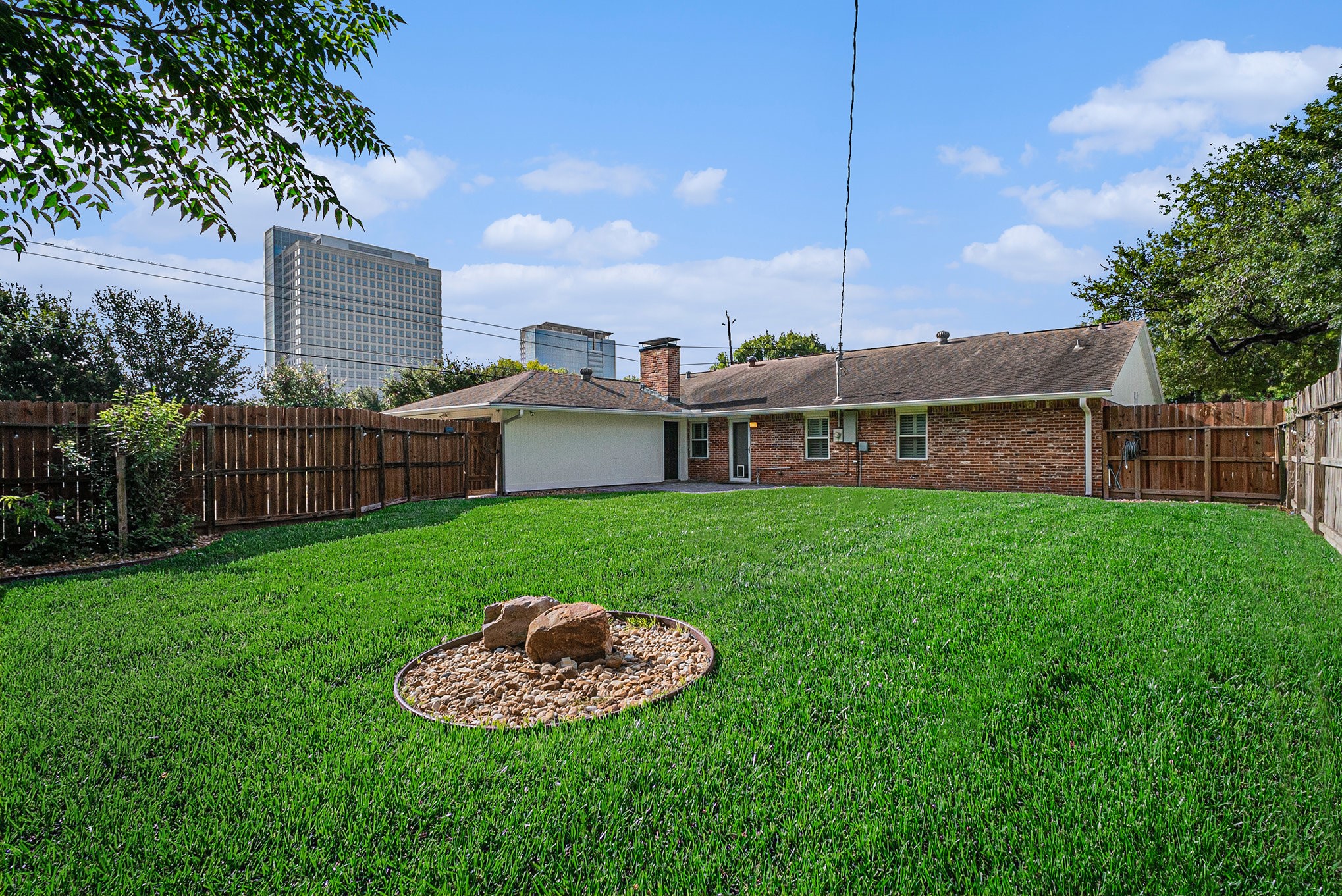 10602 Del Monte Drive Houston, TX 77042 - Photo 33 of 37 a view of a house with a backyard