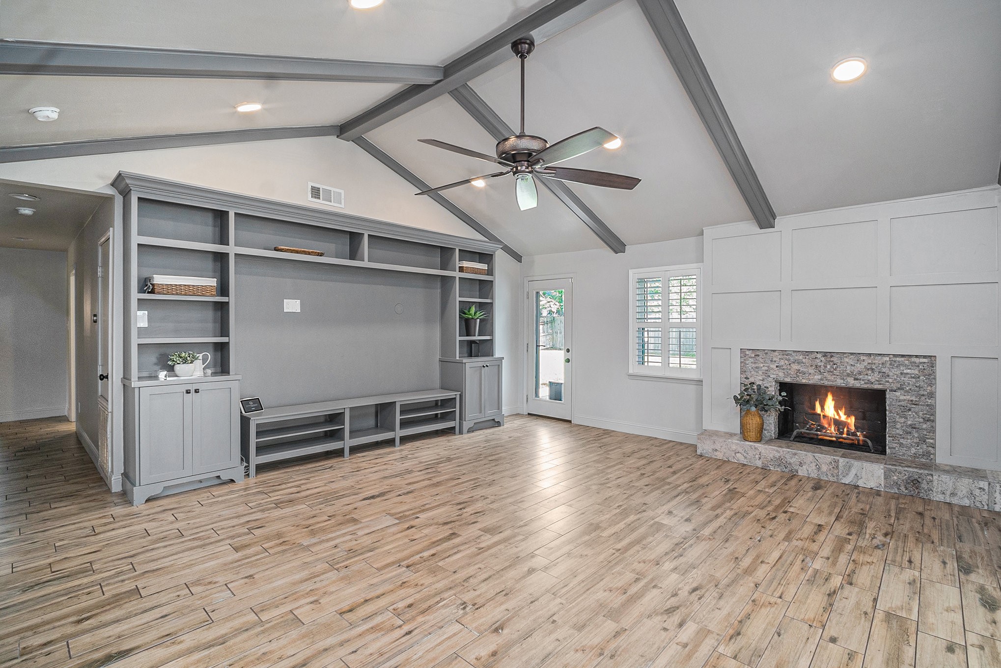 10602 Del Monte Drive Houston, TX 77042 - Photo 8 of 37 an empty room with windows and fireplace
