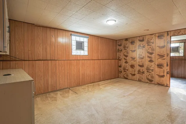 a view of an empty room with a wooden wall