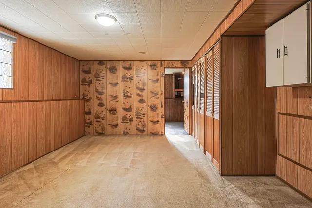 a view of entryway with wooden walls