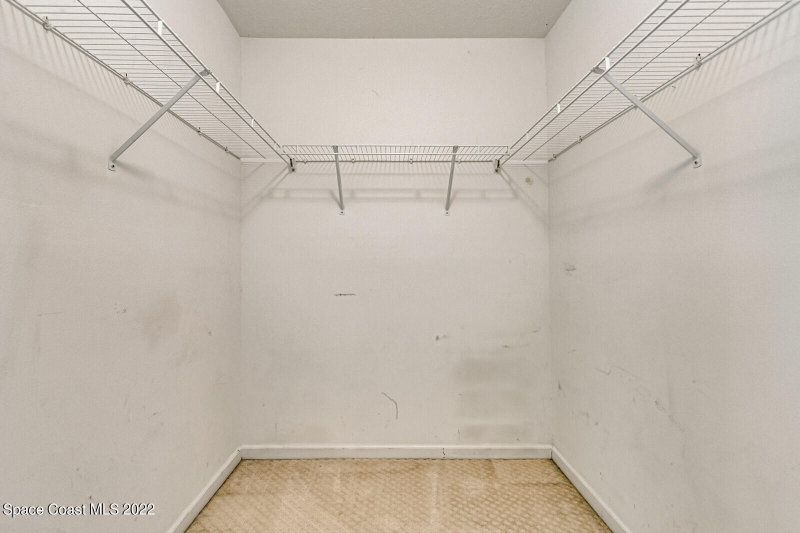 2765 Revolution Street, Unit 101 Melbourne, FL 32935 - Photo 19 of 48 a view of a room with racks on the wall