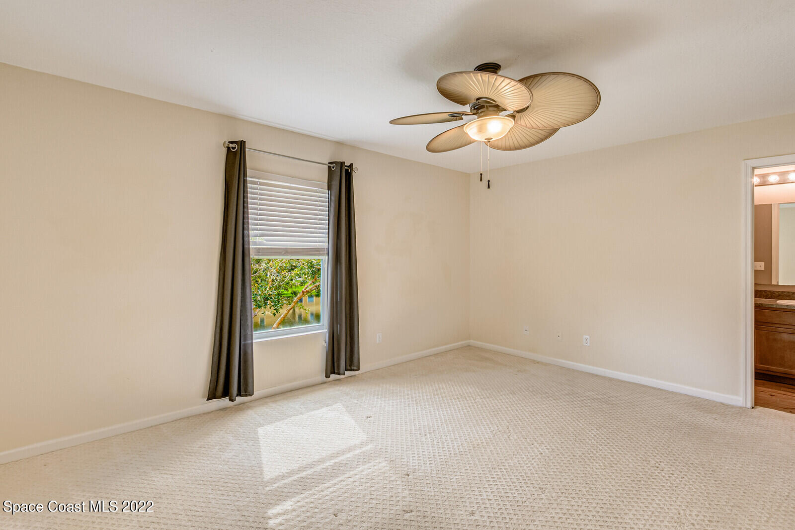 2765 Revolution Street, Unit 101 Melbourne, FL 32935 - Photo 30 of 48 a view of an empty room with a window