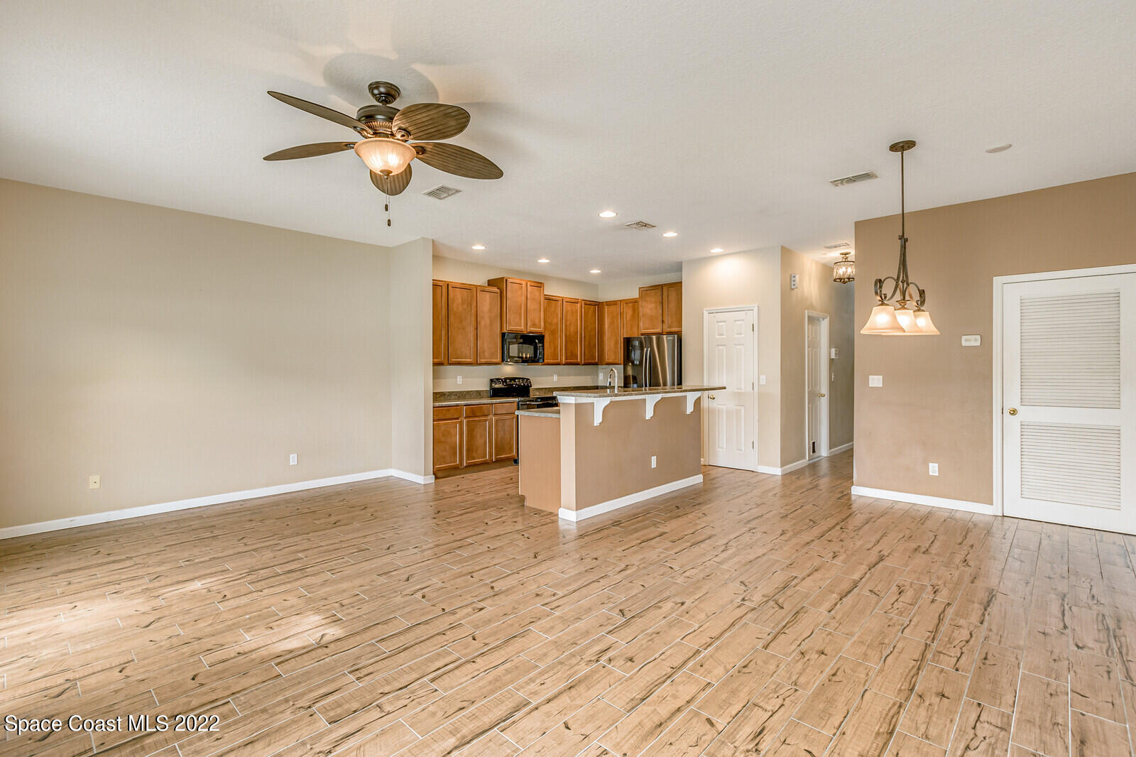 2765 Revolution Street, Unit 101 Melbourne, FL 32935 - Photo 8 of 48 Kitchen and family room