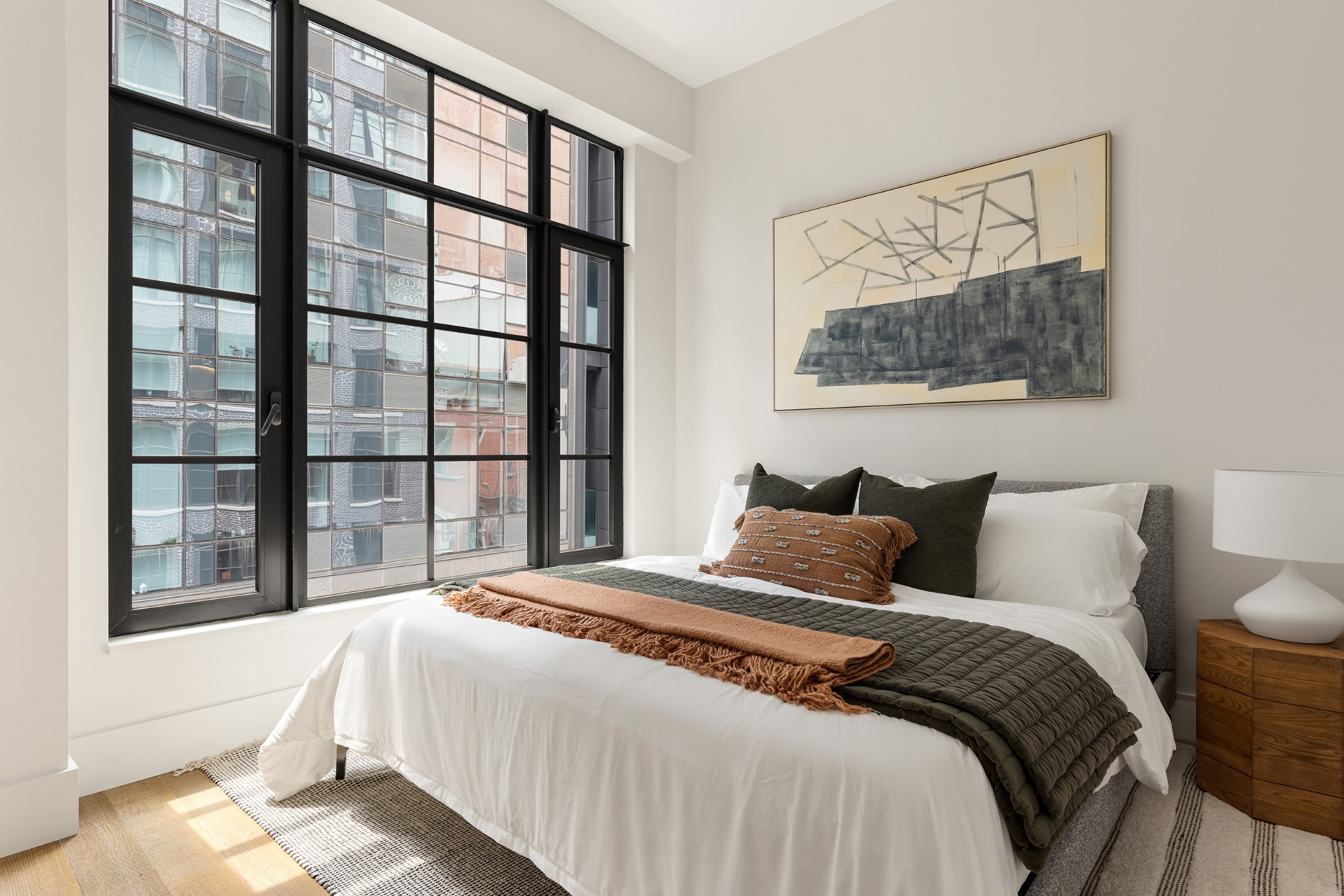 517 West 29th Street, Unit 3D Manhattan, NY 10001 - Photo 2 of 16 a bedroom with a bed and a window