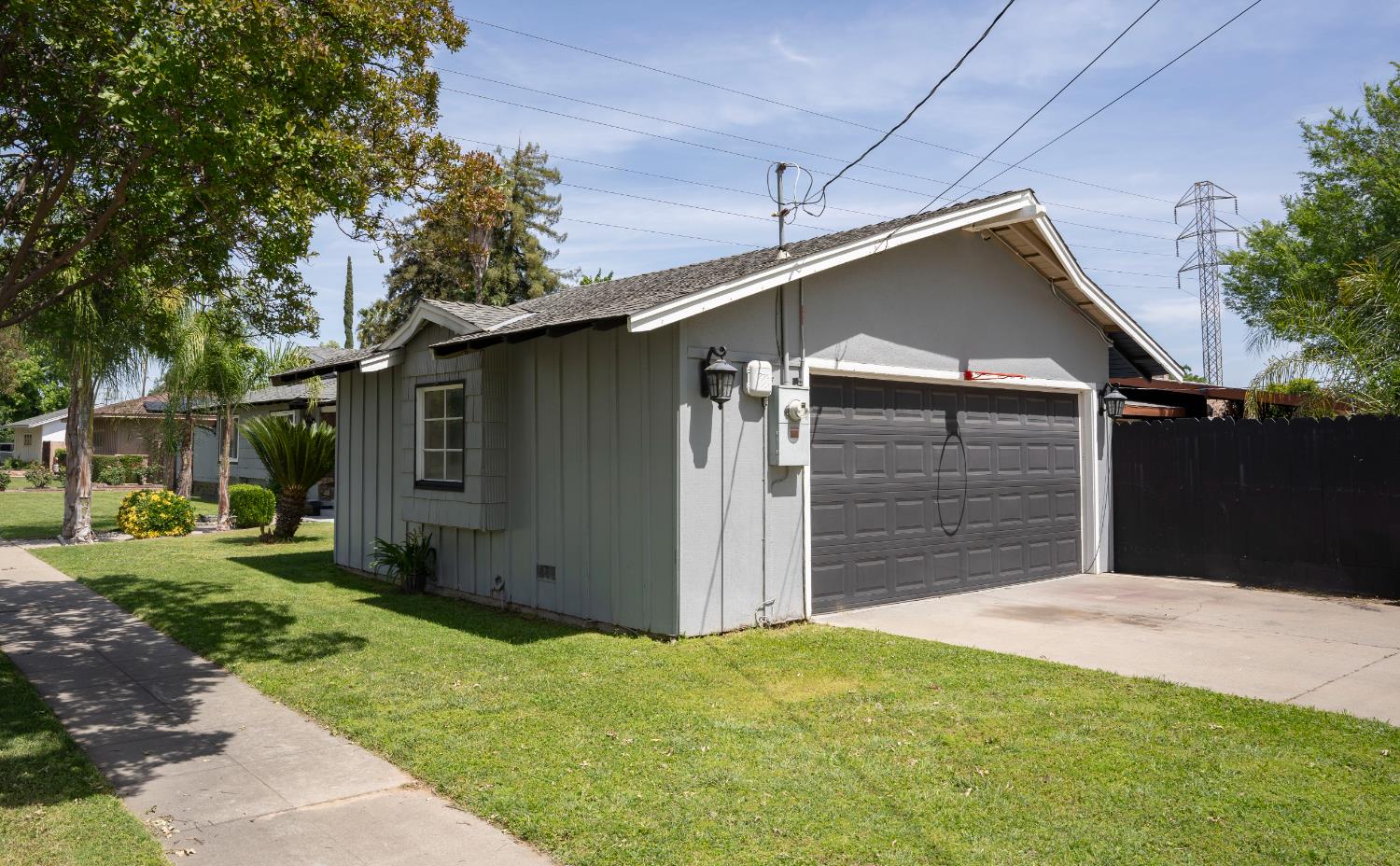 3662 North Angus Street Fresno, CA 93726 - Photo 11 of 67 a front view of a house with a yard