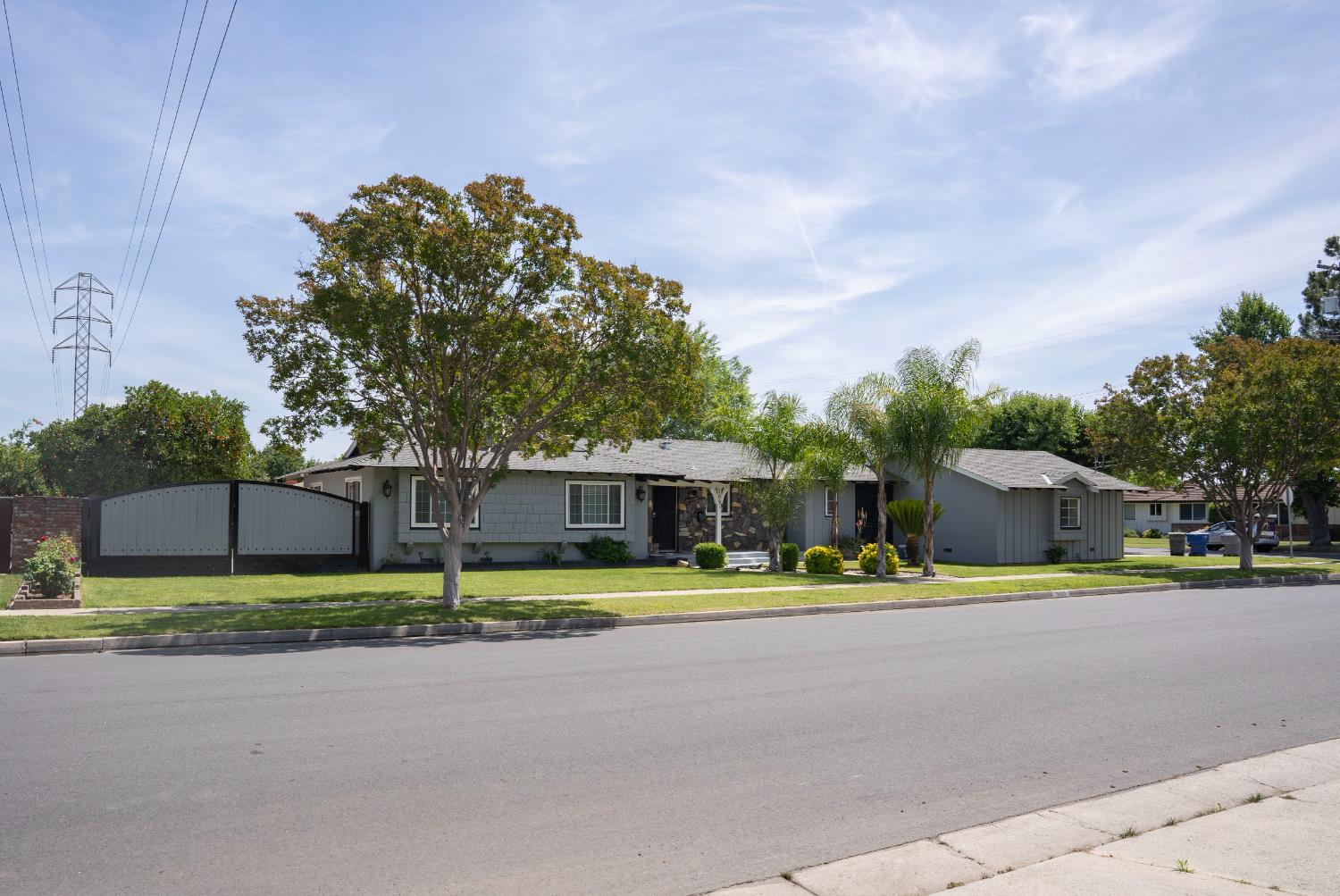 3662 North Angus Street Fresno, CA 93726 - Photo 2 of 67 a view of street with houses in the background