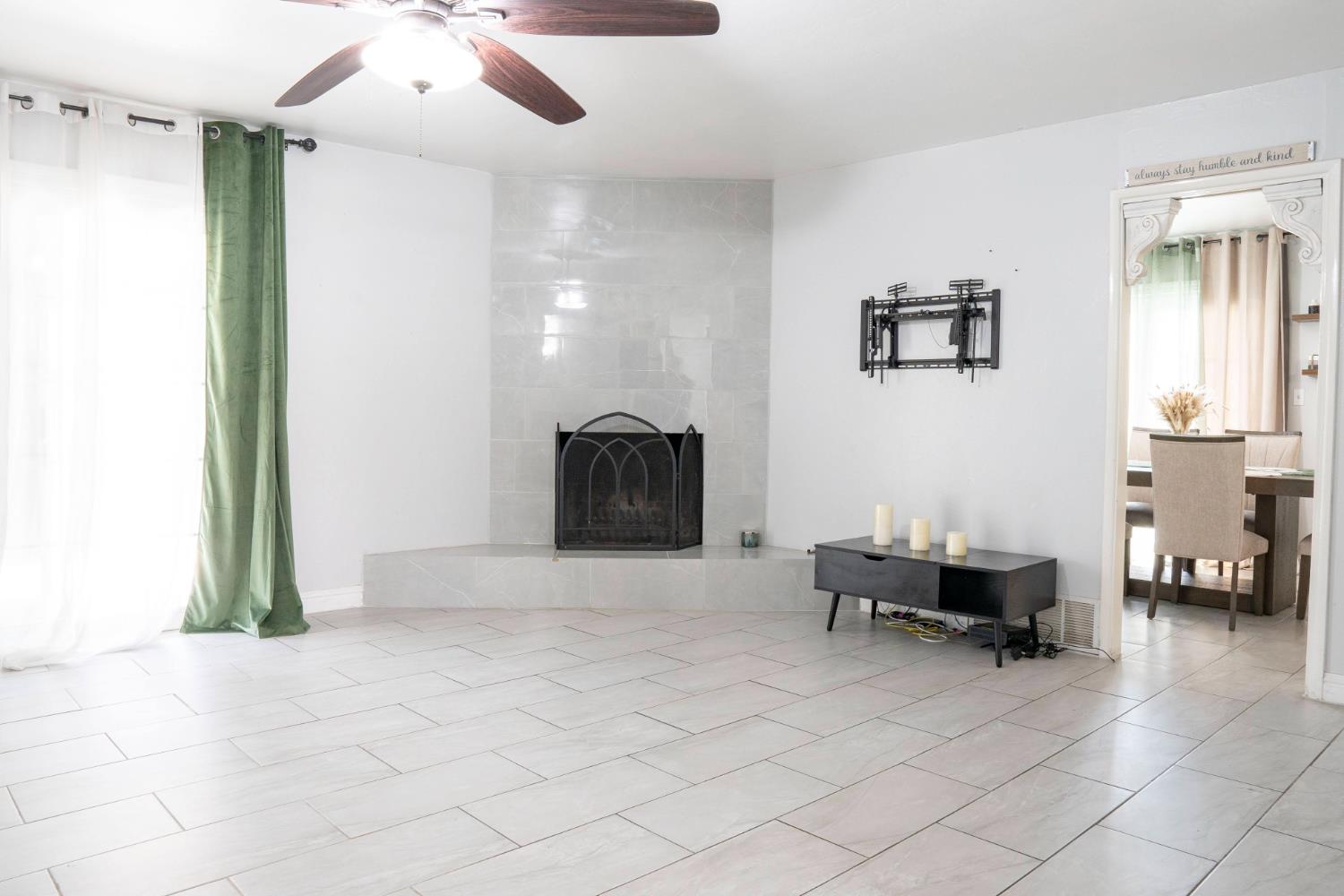 3662 North Angus Street Fresno, CA 93726 - Photo 21 of 67 a living room with furniture and a fireplace