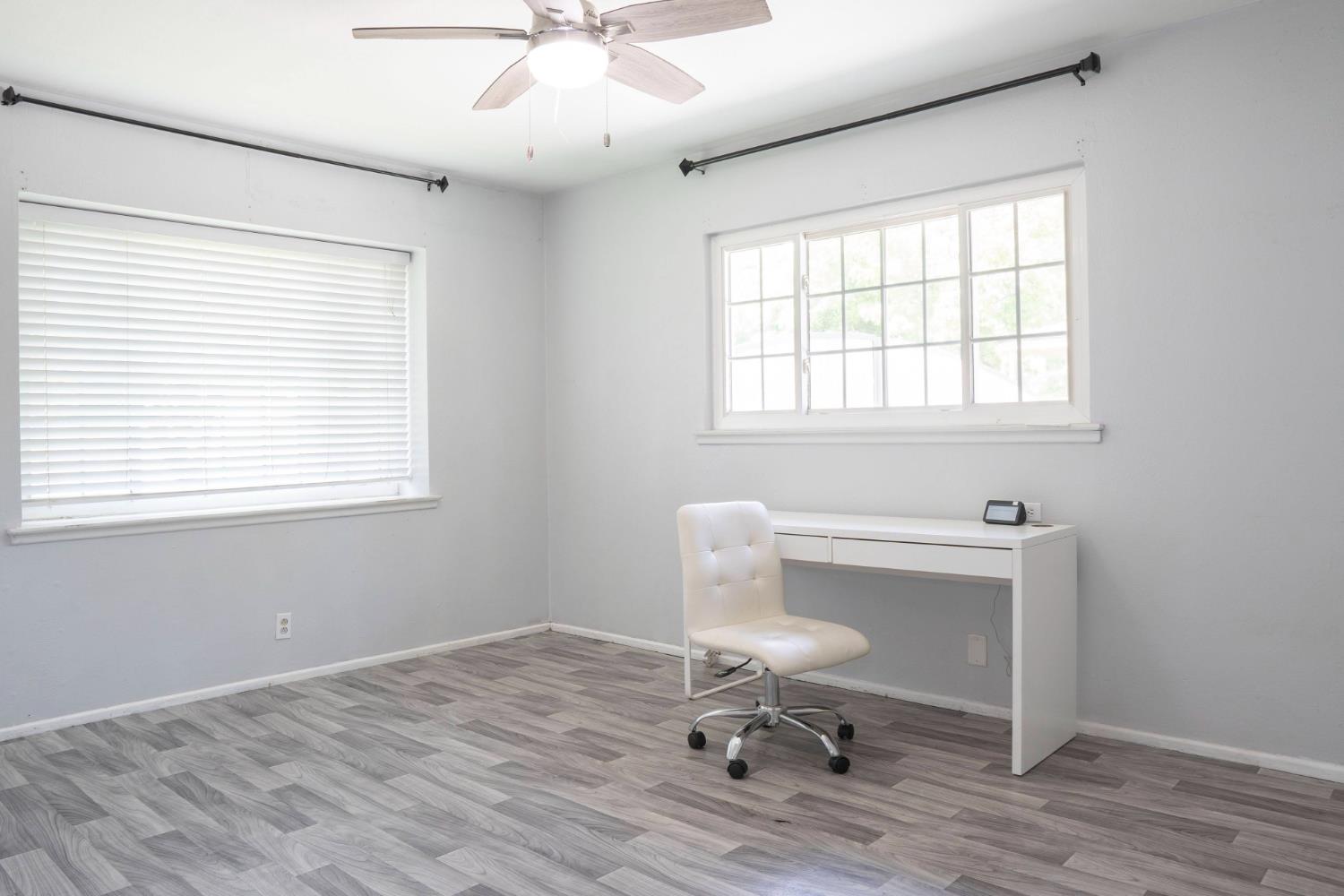 3662 North Angus Street Fresno, CA 93726 - Photo 31 of 67 a view of a workspace with wooden floor and a window