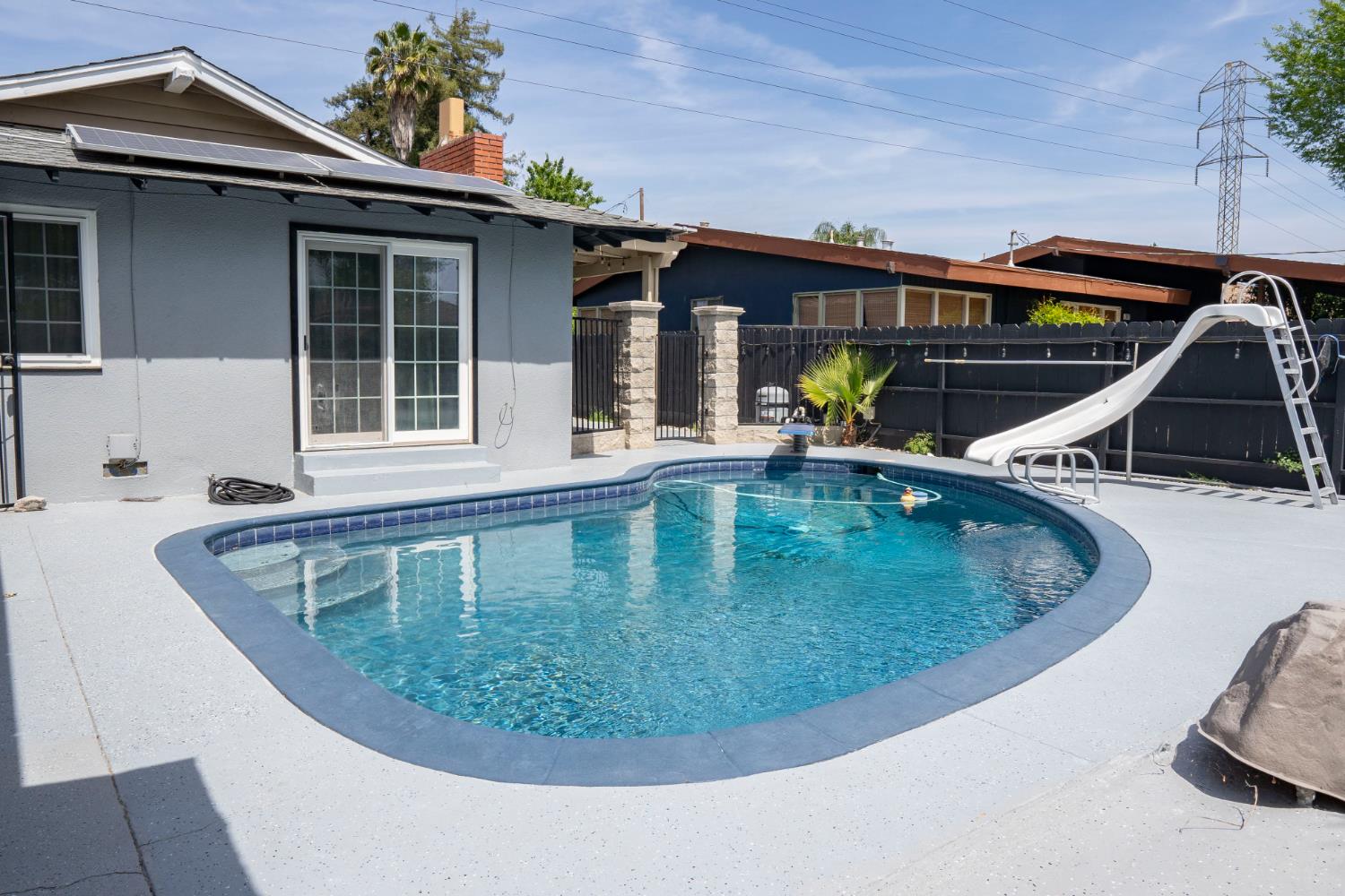 3662 North Angus Street Fresno, CA 93726 - Photo 44 of 67 a view of a house with a swimming pool