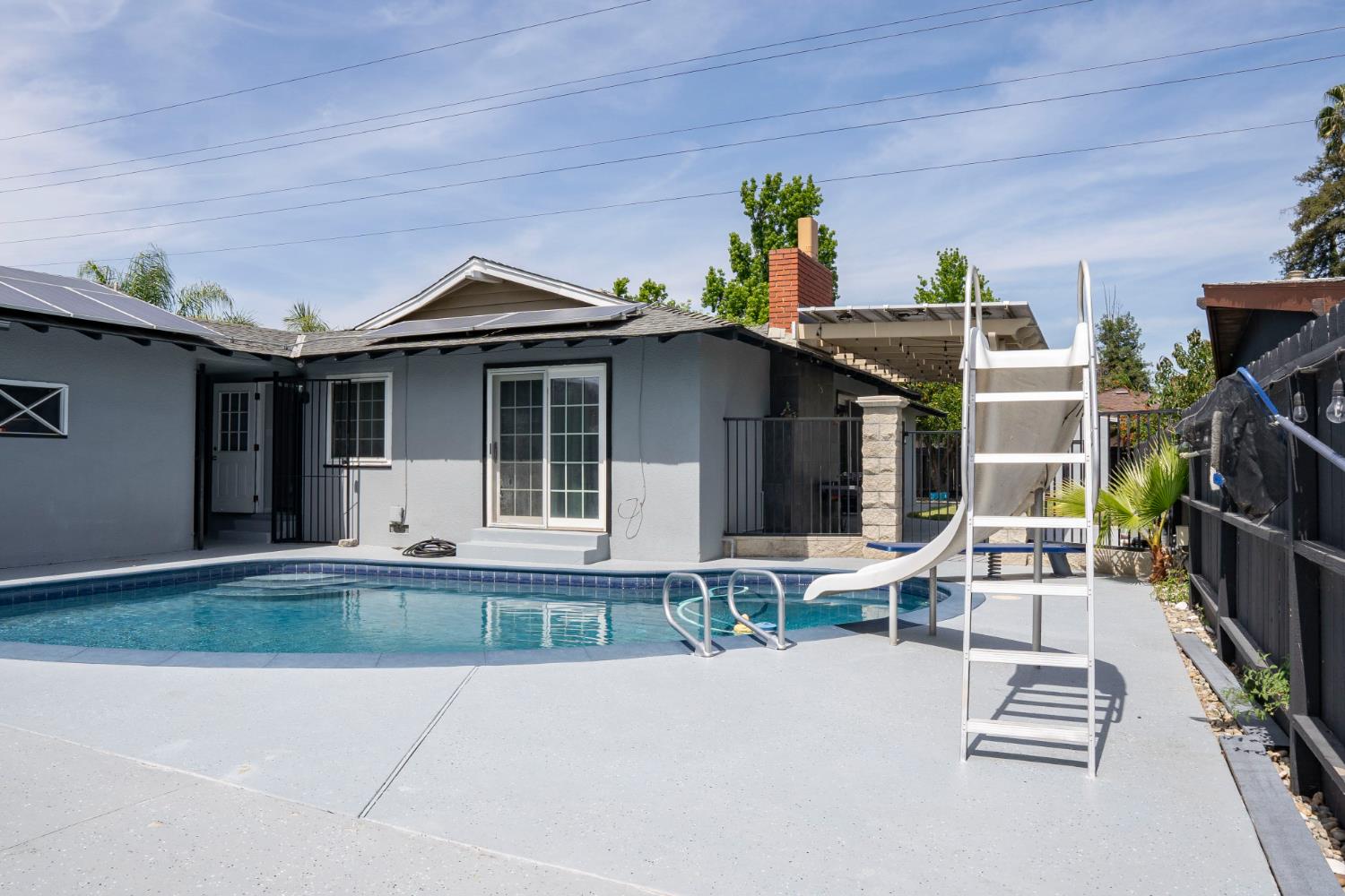 3662 North Angus Street Fresno, CA 93726 - Photo 46 of 67 a front view of a house with a patio