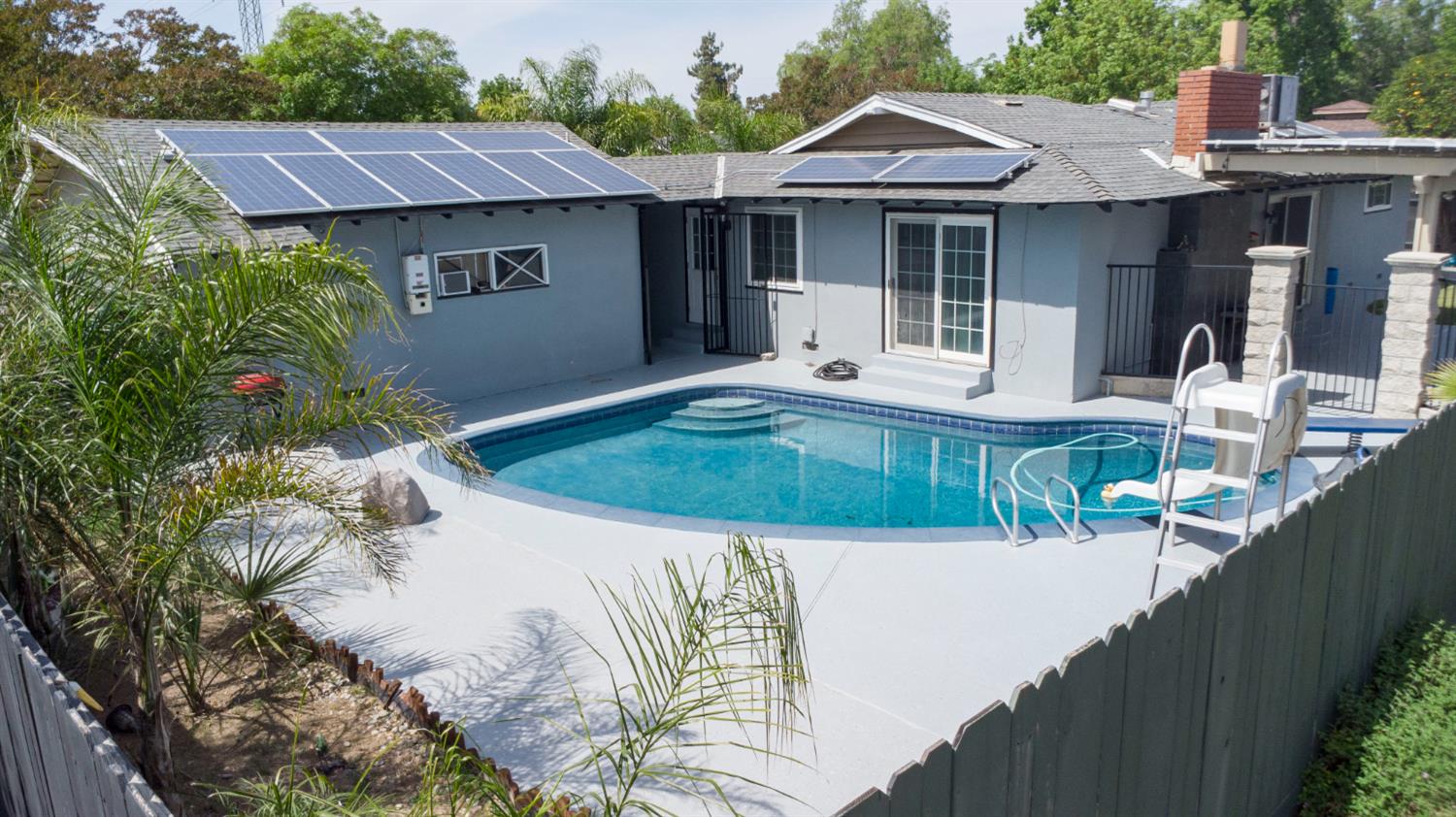 3662 North Angus Street Fresno, CA 93726 - Photo 57 of 67 a view of a house with a swimming pool