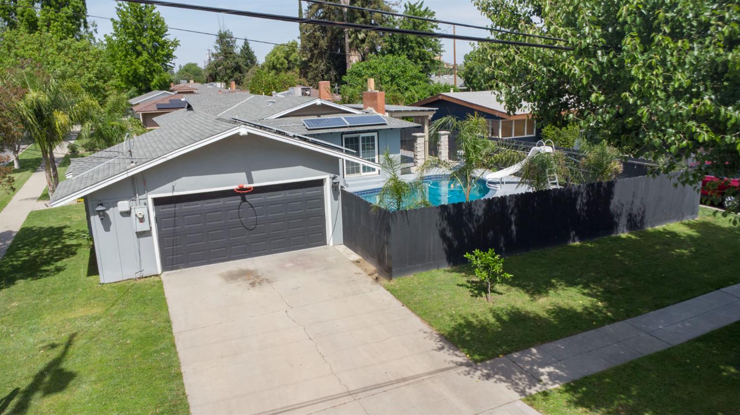 3662 North Angus Street Fresno, CA 93726 - Photo 58 of 67 a view of a yard in front view of a house