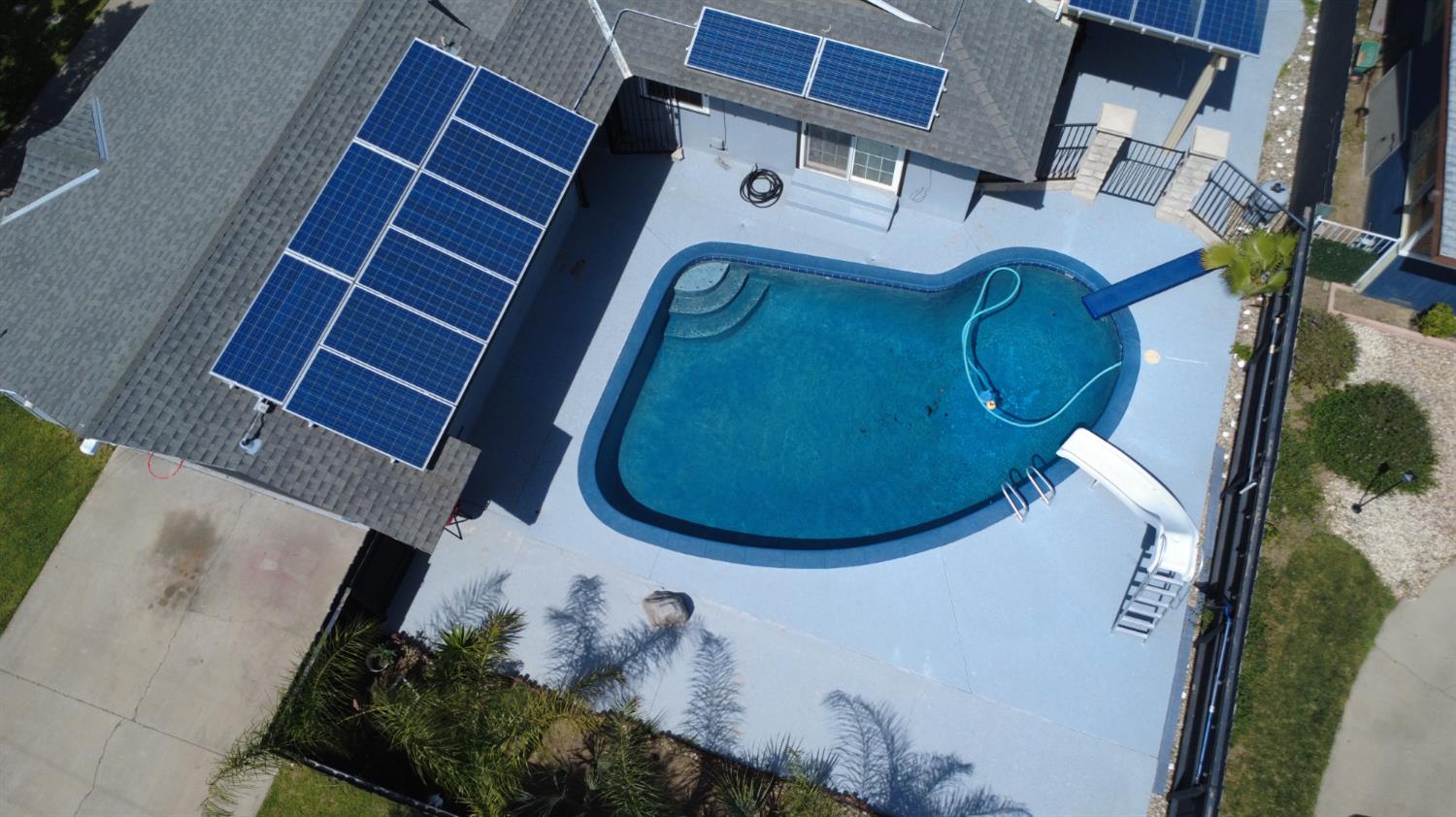 3662 North Angus Street Fresno, CA 93726 - Photo 59 of 67 an aerial view of a house with a swimming pool