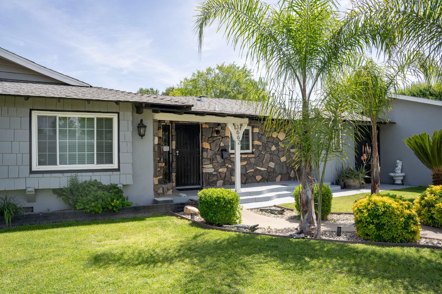 3662 North Angus Street Fresno, CA 93726 - Photo 6 of 67 a view of a house with a yard and potted plants