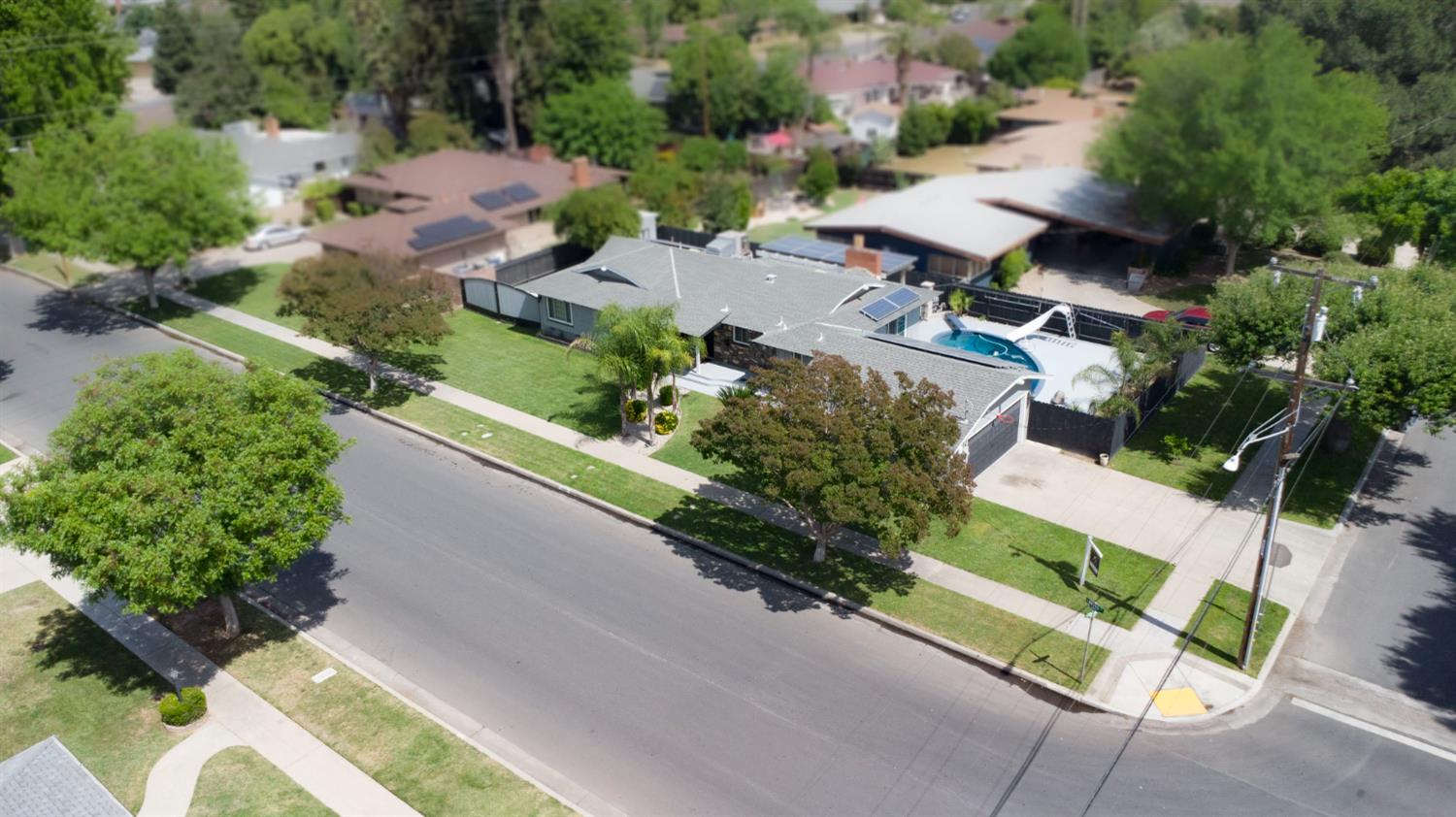3662 North Angus Street Fresno, CA 93726 - Photo 66 of 67 an aerial view of a house with garden space and street view