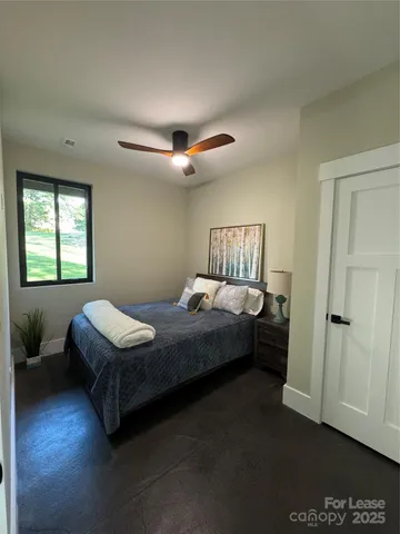 a bathroom with a shower and a toilet