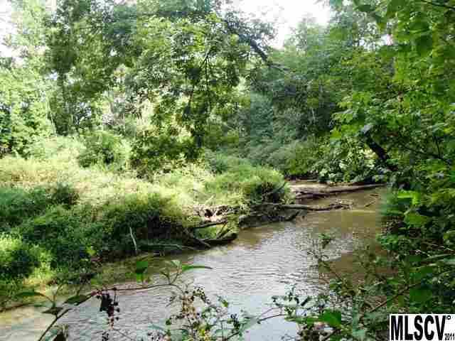 a view of a lake with lots of trees