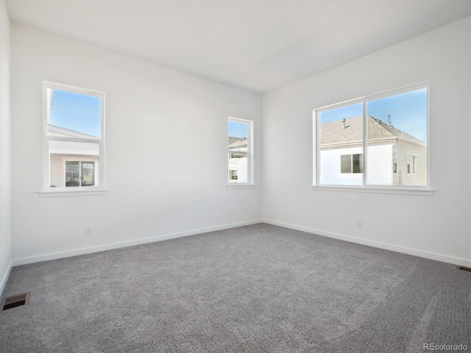 9178 Gold Lace Place Littleton, CO 80129 - Photo 16 of 26 a view of an empty room with a window
