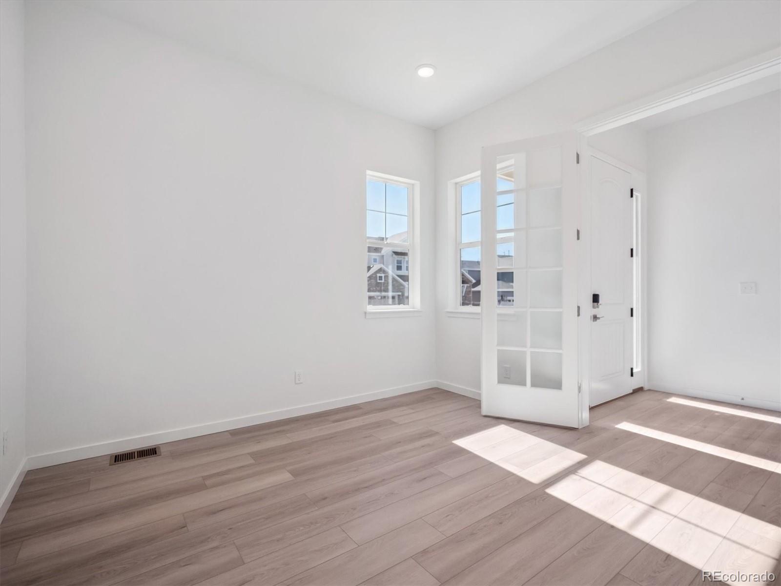 9178 Gold Lace Place Littleton, CO 80129 - Photo 2 of 26 wooden floor in an empty room
