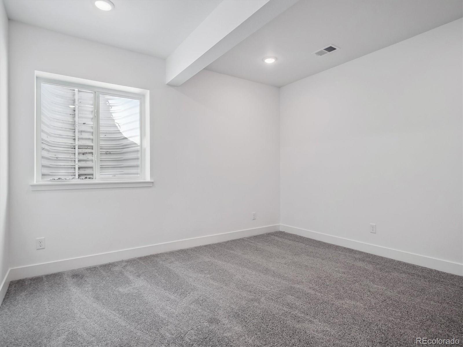 9178 Gold Lace Place Littleton, CO 80129 - Photo 24 of 26 an empty room with a window
