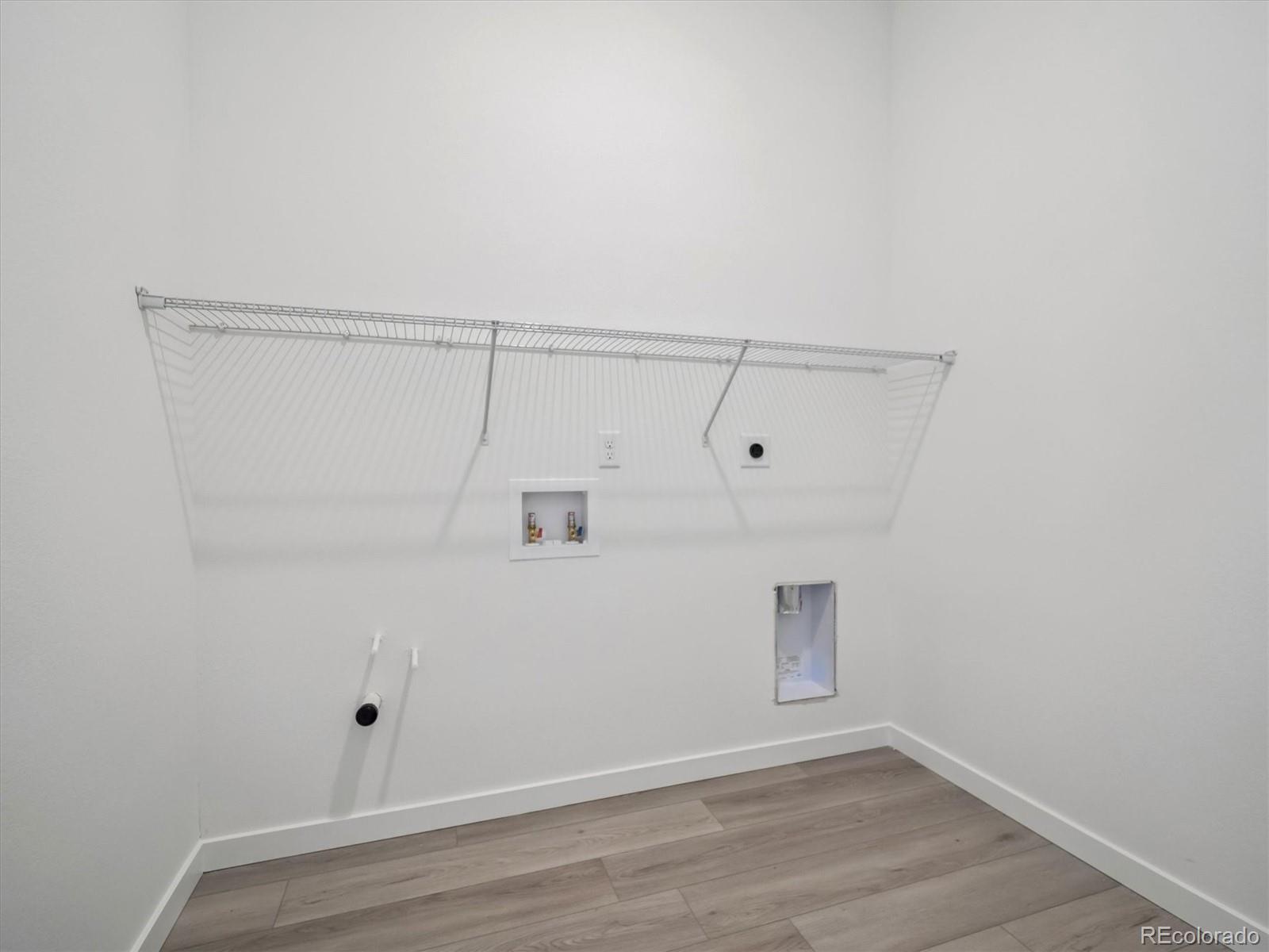 9178 Gold Lace Place Littleton, CO 80129 - Photo 3 of 26 a view of a small space with wooden floor