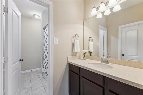 a bathroom with a sink a double vanity and a mirror