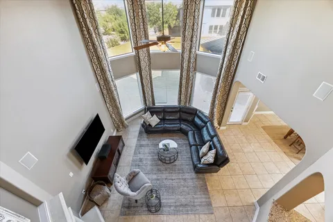 a view of living room with furniture and a mirror
