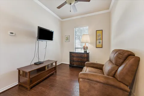 a bedroom with a bed and a desk