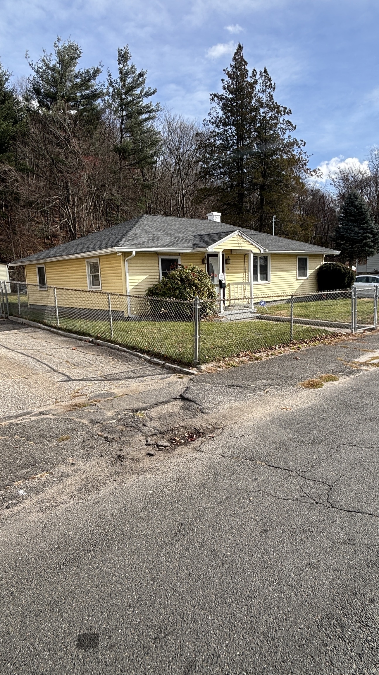 341 Oak Street Waterbury, CT 06705 - Photo 11 of 34 a front view of a house with a yard and garage