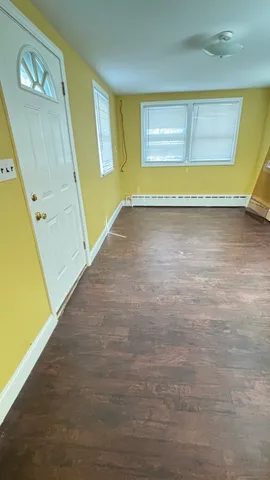 a view of kitchen and wooden floor