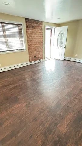 an empty room with a empty space and windows