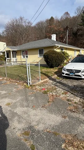 a view of a house with backyard space