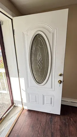 a view of a door with washer and dryer