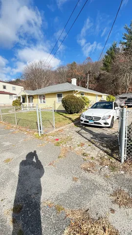 a view of a swimming pool with a yard