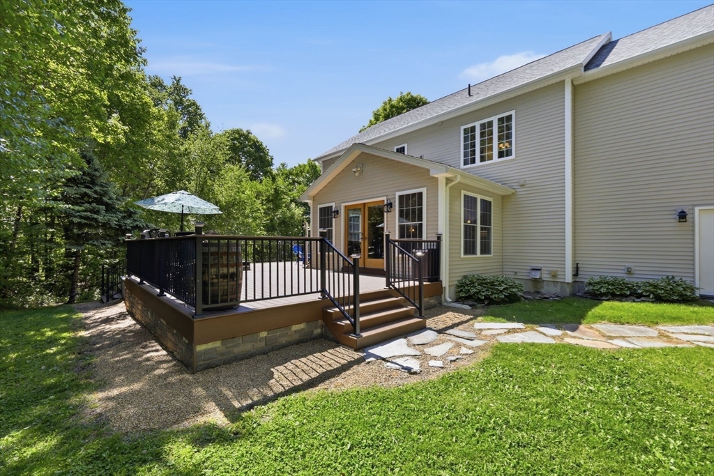 345 Bragg Road Warren, MA 01585 - Photo 32 of 41 a view of a house with backyard and a tree