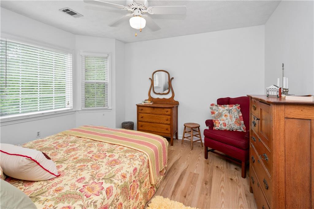 405 Ridgemont Drive Fayetteville, GA 30215 - Photo 30 of 43 a bedroom with a bed and a dresser