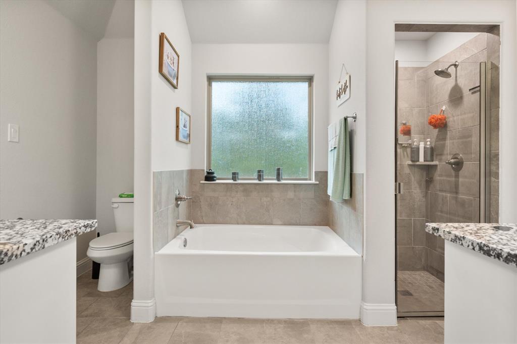 103 Randal Row Corsicana, TX 75110 - Photo 23 of 35 a white bath tub sitting next to a bathroom sink