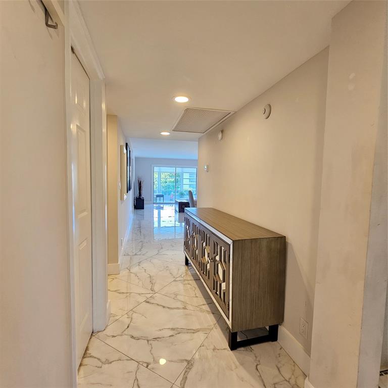 1705 Andros Isle, Unit C3 Coconut Creek, FL 33066 - Photo 11 of 36 a view of hallway with wooden floor