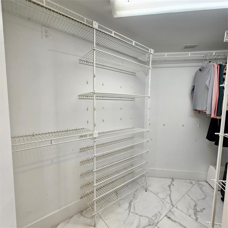 1705 Andros Isle, Unit C3 Coconut Creek, FL 33066 - Photo 20 of 36 a view of walk in closet