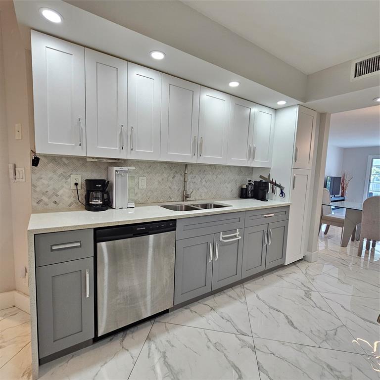 1705 Andros Isle, Unit C3 Coconut Creek, FL 33066 - Photo 3 of 36 a kitchen with cabinets and window