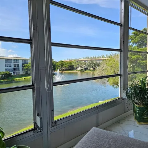 a bedroom with a bed and a lamp