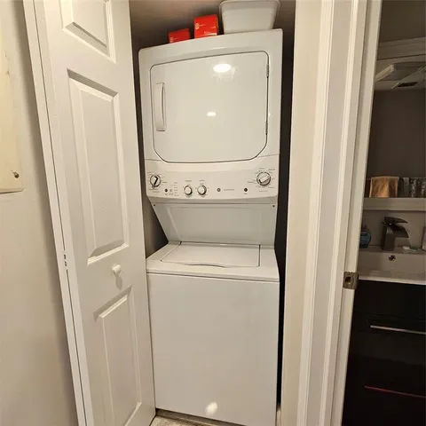 a view of a lake with houses in the back